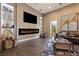 Comfortable living room featuring a fireplace, mounted TV, and stylish decor at 17 Grand Corniche Dr, Henderson, NV 89011