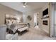 Elegant main bedroom featuring a fireplace, ensuite bath, and a seating area at 17 Grand Corniche Dr, Henderson, NV 89011