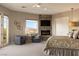 Spacious main bedroom with fireplace, sitting area, plush carpet, and mountain views at 17 Grand Corniche Dr, Henderson, NV 89011