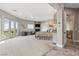 Bright main bedroom with fireplace, balcony access, sitting area, and neutral color palette at 17 Grand Corniche Dr, Henderson, NV 89011
