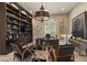 Executive office with custom built-ins and cozy seating area at 17 Grand Corniche Dr, Henderson, NV 89011