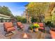 Outdoor patio featuring a fountain, fire pit, and comfortable seating for relaxation and entertaining at 17 Grand Corniche Dr, Henderson, NV 89011