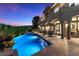 Inviting outdoor pool area with manicured landscaping, lounge seating, and a covered patio at 17 Grand Corniche Dr, Henderson, NV 89011