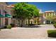 Charming town square with vibrant storefronts, lush trees, and inviting benches at 17 Grand Corniche Dr, Henderson, NV 89011
