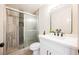 Modern bathroom with tiled shower, glass door, and sleek vanity with black fixtures at 1800 Edmond St # 115, Las Vegas, NV 89146