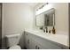 Bright bathroom with white vanity, modern fixtures, and framed mirror at 1800 Edmond St # 115, Las Vegas, NV 89146
