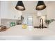Stylish kitchen with stainless steel appliances, quartz countertops, and pendant lights at 1800 Edmond St # 115, Las Vegas, NV 89146
