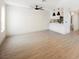 Bright living room with an open concept and hardwood floors features an adjacent kitchen at 1800 Edmond St # 115, Las Vegas, NV 89146