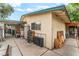 A home exterior showcases the driveway, yard with overgrown storage area, and exterior features at 1904 Fontenelle St, Las Vegas, NV 89102