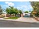 Charming single-story home featuring a well-manicured front lawn and mature trees at 1904 Fontenelle St, Las Vegas, NV 89102
