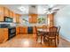 Eat-in kitchen featuring wood cabinets, laminate countertops, and black appliances at 1904 Fontenelle St, Las Vegas, NV 89102