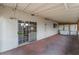 Covered patio featuring a brick floor and a sliding glass door providing access to the backyard at 1904 Fontenelle St, Las Vegas, NV 89102