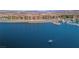 Gorgeous aerial view of a lakefront complex with a boat dock, emphasizing the waterfront lifestyle at 20 Via Mantova # 306, Henderson, NV 89011