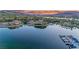 Stunning aerial view of luxury waterfront homes surrounded by lush landscaping and peaceful lake waters at 20 Via Mantova # 306, Henderson, NV 89011