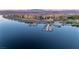 Picturesque aerial view of a waterfront property with a marina, showcasing the serene lake setting at 20 Via Mantova # 306, Henderson, NV 89011