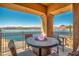 Balcony featuring a patio set with fire pit and spectacular views of the lake at 20 Via Mantova # 306, Henderson, NV 89011