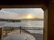 Balcony featuring a patio set and sunset views of the lake at 20 Via Mantova # 306, Henderson, NV 89011