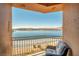 Breathtaking lake view from a private balcony with comfortable seating, perfect for relaxing at 20 Via Mantova # 306, Henderson, NV 89011