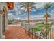 Balcony with tile floors, table and chairs, and beautiful view of the lake at 20 Via Mantova # 306, Henderson, NV 89011