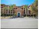 Stunning exterior view of a luxury building with manicured landscaping and towering palm trees at 20 Via Mantova # 306, Henderson, NV 89011