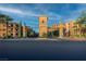Grand community entrance with manicured landscaping, palm trees, and architectural tower at 20 Via Mantova # 306, Henderson, NV 89011