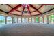 A bright event space features floor-to-ceiling windows, arched ceilings, and ample space at 20 Via Mantova # 306, Henderson, NV 89011