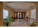 A cozy foyer features a mosaic tile floor, houseplants, and decorative accents at 20 Via Mantova # 306, Henderson, NV 89011