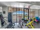 Bright gym with stationary bike, equipment, and a view of the outdoors at 20 Via Mantova # 306, Henderson, NV 89011