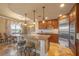 Gourmet kitchen with an island, stainless steel appliances, and lake views, blending style and functionality at 20 Via Mantova # 306, Henderson, NV 89011