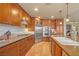 Beautiful kitchen with stainless steel appliances, granite countertops, and tile flooring at 20 Via Mantova # 306, Henderson, NV 89011