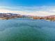 Expansive lake view showcasing clear water and distant mountains under a bright blue sky at 20 Via Mantova # 306, Henderson, NV 89011