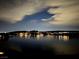 Night view showcasing the lights of the cityscape reflecting on the water at 20 Via Mantova # 306, Henderson, NV 89011
