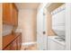 Convenient laundry room features cabinets for storage and an efficient stacked washer and dryer at 20 Via Mantova # 306, Henderson, NV 89011