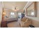 Serene main bedroom with water views and a sitting area at 20 Via Mantova # 306, Henderson, NV 89011