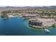 Aerial view of a waterfront estate with private dock, emphasizing luxury lake living at 20 Via Mantova # 306, Henderson, NV 89011