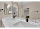 Bathroom featuring dual sinks, modern fixtures, and elegant mirrors at 2007 Cutlass Dr # 0, Henderson, NV 89014