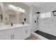 Modern bathroom featuring double vanity and a spacious walk-in shower with black hardware at 2007 Cutlass Dr # 0, Henderson, NV 89014