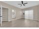 Bright bedroom with new flooring, neutral walls, a ceiling fan and view into the bathroom at 2007 Cutlass Dr # 0, Henderson, NV 89014
