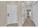 Hallway with neutral paint and modern baseboards leading to interior rooms at 2007 Cutlass Dr # 0, Henderson, NV 89014