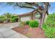 Attractive home featuring a well-manicured lawn, desert plants, and a two-car garage, offering curb appeal at 224 Silver Castle St, Las Vegas, NV 89144