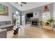 Cozy living room with a fireplace, a sliding glass door, and modern decor at 224 Silver Castle St, Las Vegas, NV 89144