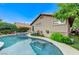 Inviting pool and spa with blue tile accents and lush landscaping at 224 Silver Castle St, Las Vegas, NV 89144
