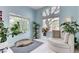Relaxing sitting area with abundant natural light and views of backyard landscaping at 224 Silver Castle St, Las Vegas, NV 89144