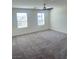 Neutral bedroom with carpet flooring, ceiling fan, and natural light at 2444 Padulle Pl, Henderson, NV 89044