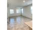 Spacious living room featuring neutral walls and ample sunlight at 2444 Padulle Pl, Henderson, NV 89044