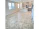 Open-concept living room featuring tile floors and abundant natural light at 2444 Padulle Pl, Henderson, NV 89044