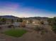 Expansive aerial view of the home, showcasing the large lot and beautiful mountain views at 2500 S Zephyr Ave, Pahrump, NV 89048
