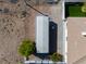 Aerial shot showing the metal carport, the side of the house, and desert landscaping at 2500 S Zephyr Ave, Pahrump, NV 89048
