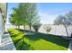A spacious backyard features artificial grass and a decorative border along a block fence at 2500 S Zephyr Ave, Pahrump, NV 89048