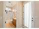 Bathroom showcasing vanity, tub/shower combo, and a door leading outside at 2500 S Zephyr Ave, Pahrump, NV 89048